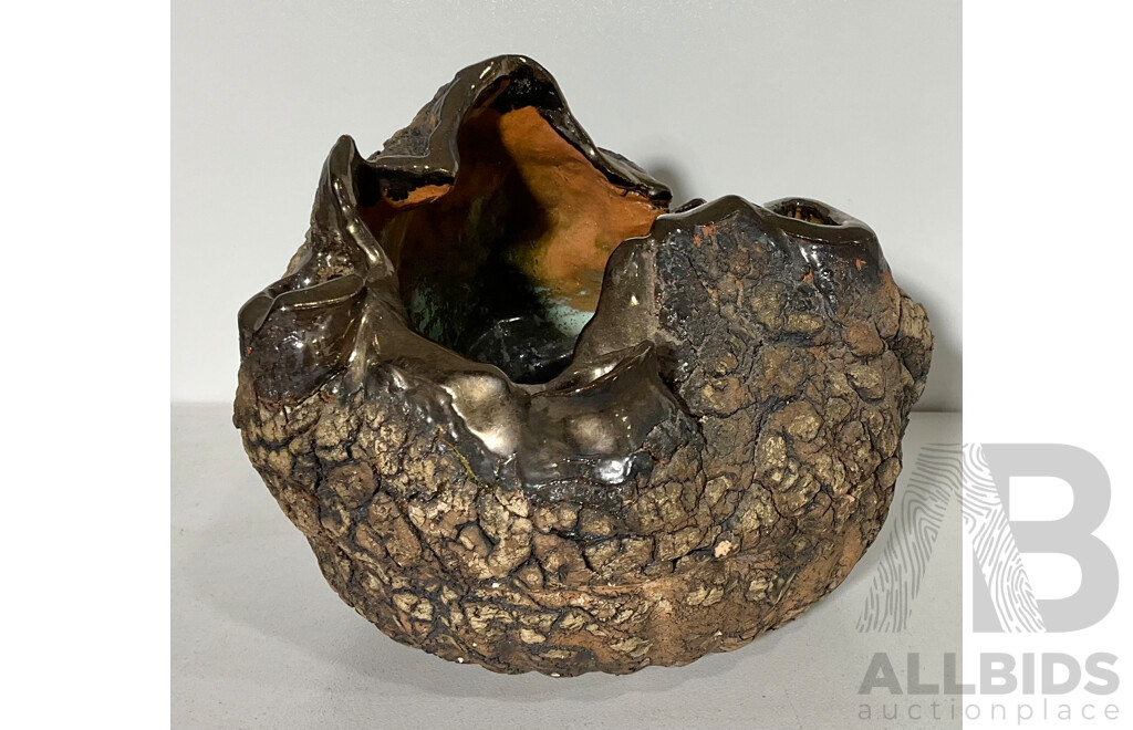 An Unusual Pottery Sculpture with Rock Like Exterior