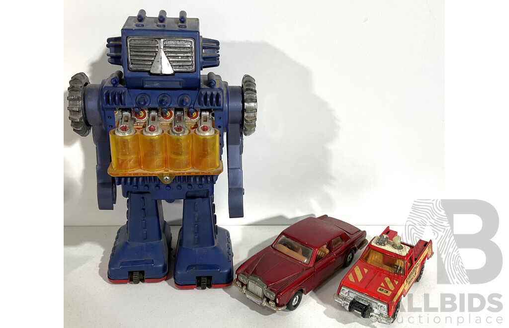 Three Vintage Toys Inclduing Matchbow K-65 Plymouth Trail Duster, Corgi Rolls Royce Corniche and Japanese Robot