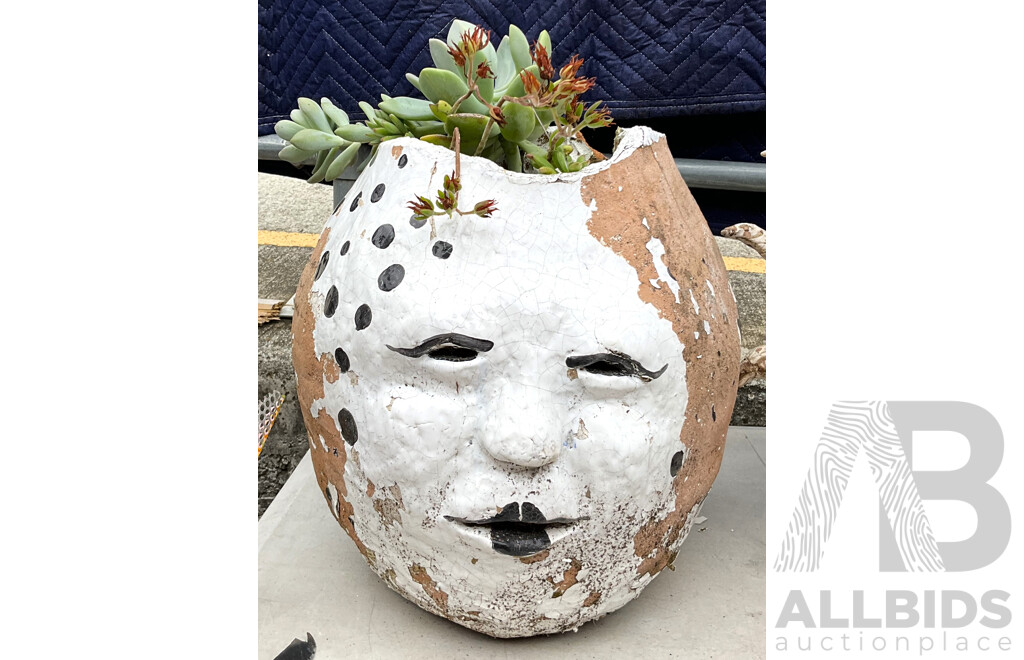 Two Round Planters Including One with Scultped Face