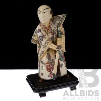 Vintage Asian Carved and Dyed Bone Samurai Statue on Wooden Stand