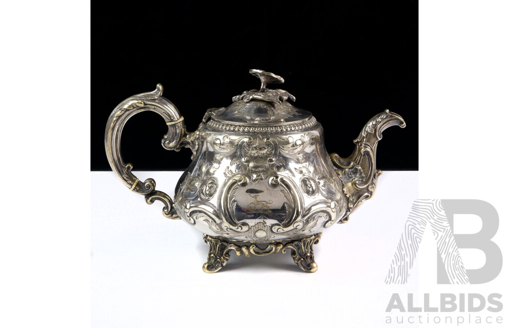 Antique Sterling Silver Teapot with Heavily Repoussed Detail with Engraved Canine Crest, Ivory Heat Spacers and Flower Form Finial, Sheffield, Probably 1899