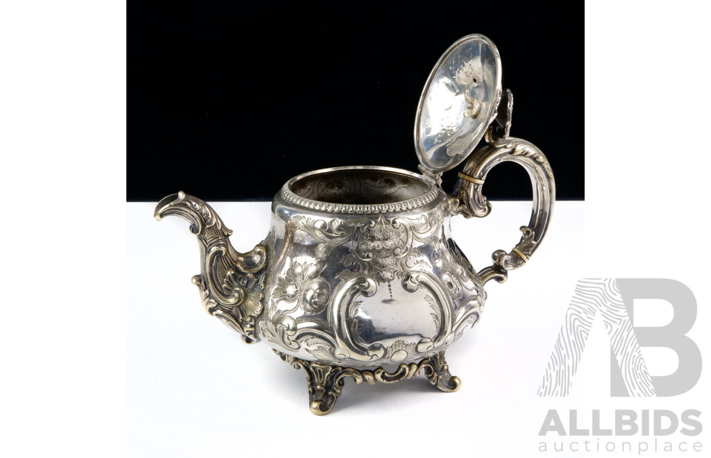 Antique Sterling Silver Teapot with Heavily Repoussed Detail with Engraved Canine Crest, Ivory Heat Spacers and Flower Form Finial, Sheffield, Probably 1899