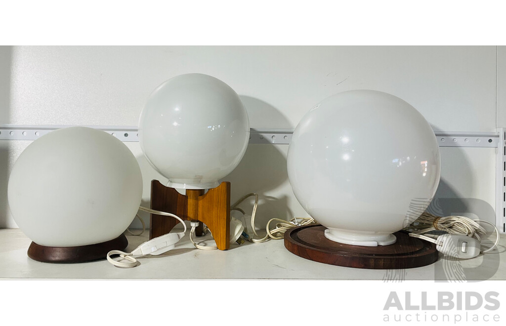 Collection of Three Globe Table Lamps of Varying Sized with Diverse Wooden Bases