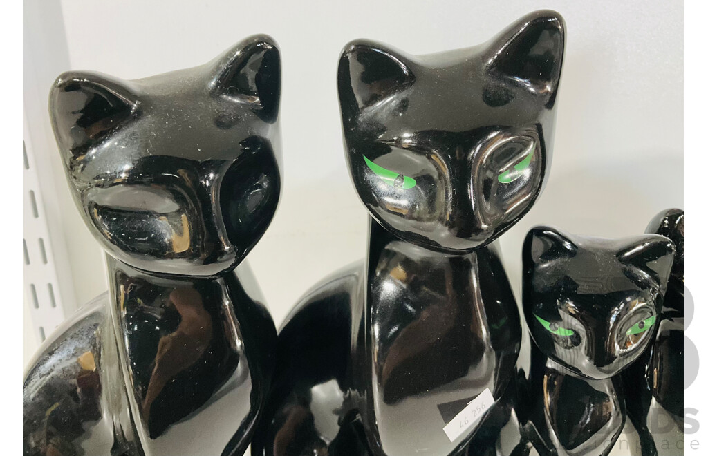 Collection of Four Ceramic Vintage Artmark Black Cats with Green Eyes Alongside One with No Painted Eyes