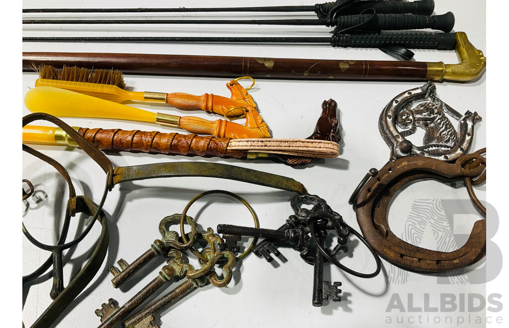 Quantity of Horse Related Items Including Three Riding Whips, a Brass Horse Head Walking Stick, Stirrups, Horse Shoes and More