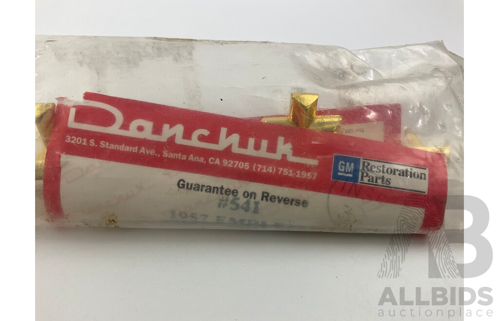 Danchuk 1957 Gold Chevrolet Badge in Original Packaging