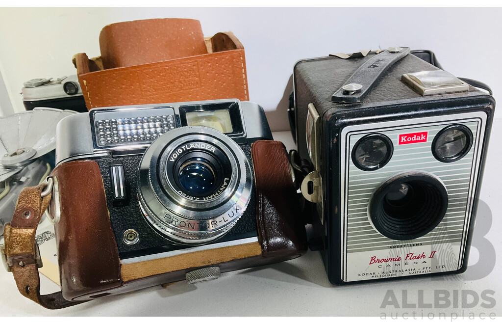 Collection of Four Vintage Cameras Including a Kodak Brownie Flash II, Kodak Retina I B, Olympus Pen EE-2 and a Voigtlander Vito Automatic and More