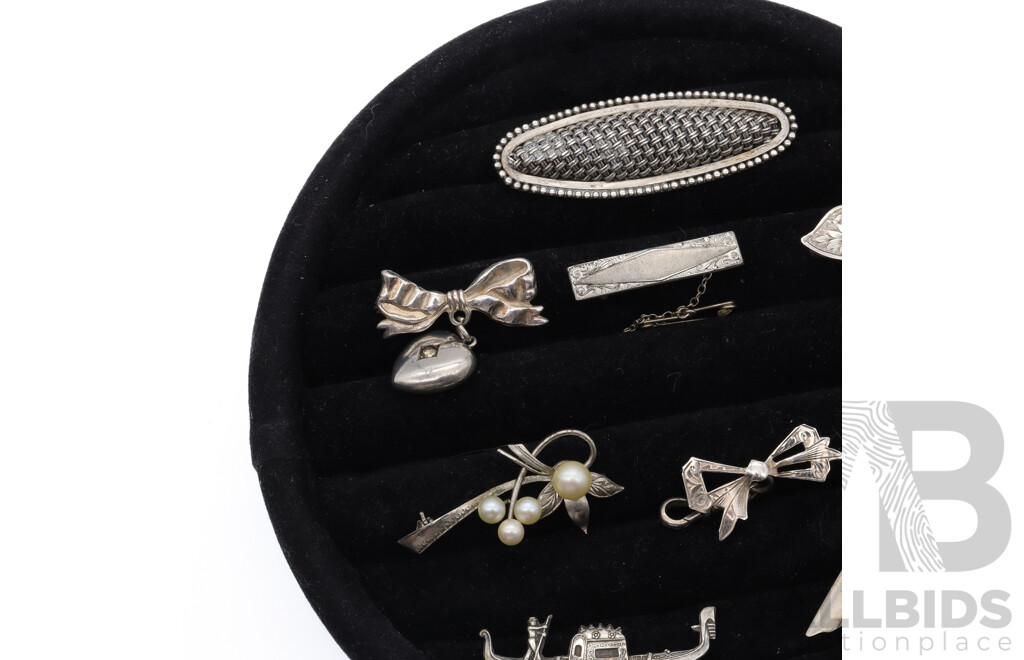 Sterling Silver Vintage (8) Brooch Collection, 38.64 Grams, on Black Velvet Brooch Display