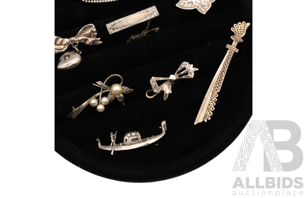 Sterling Silver Vintage (8) Brooch Collection, 38.64 Grams, on Black Velvet Brooch Display