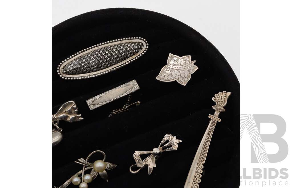 Sterling Silver Vintage (8) Brooch Collection, 38.64 Grams, on Black Velvet Brooch Display