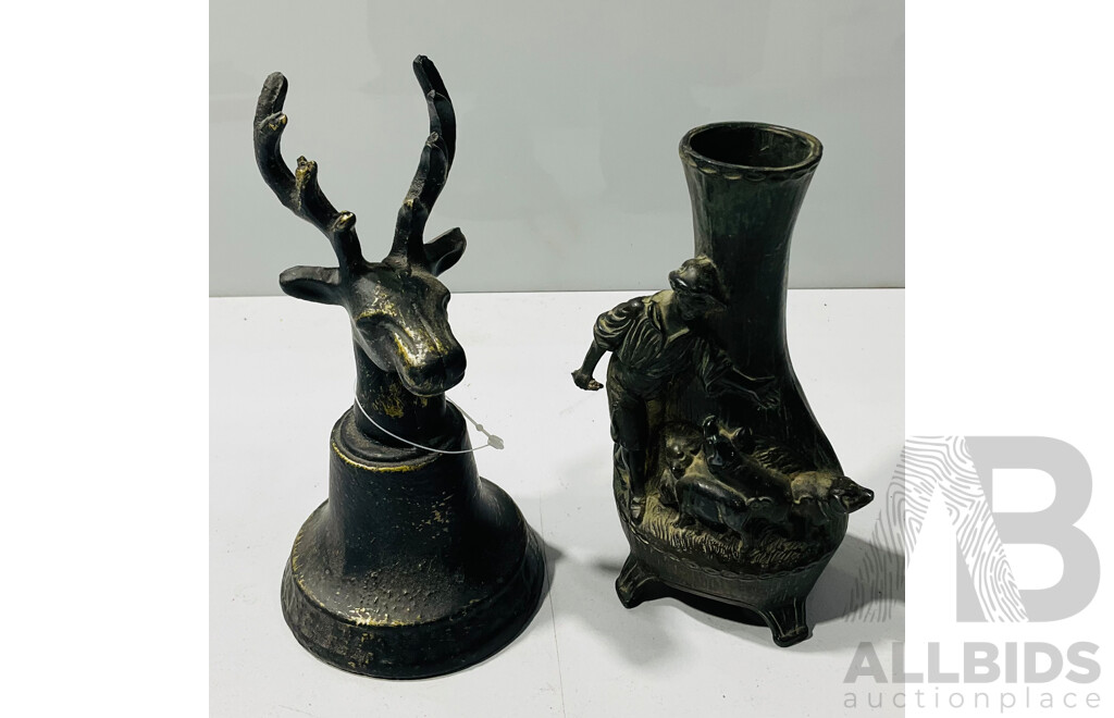 Metal Reindeer Head Bell Alongside a Metal Vase with Young Boy Feeding Piglets