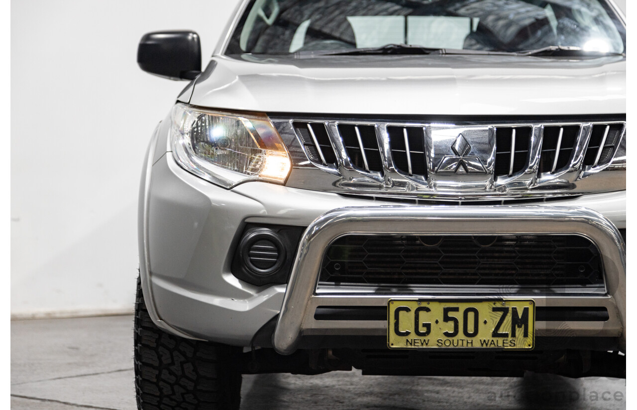 10/2015 Mitsubishi Triton GLX (4x4) MQ MY16 Dual Cab Utility Metallic Silver Turbo Diesel 2.4L