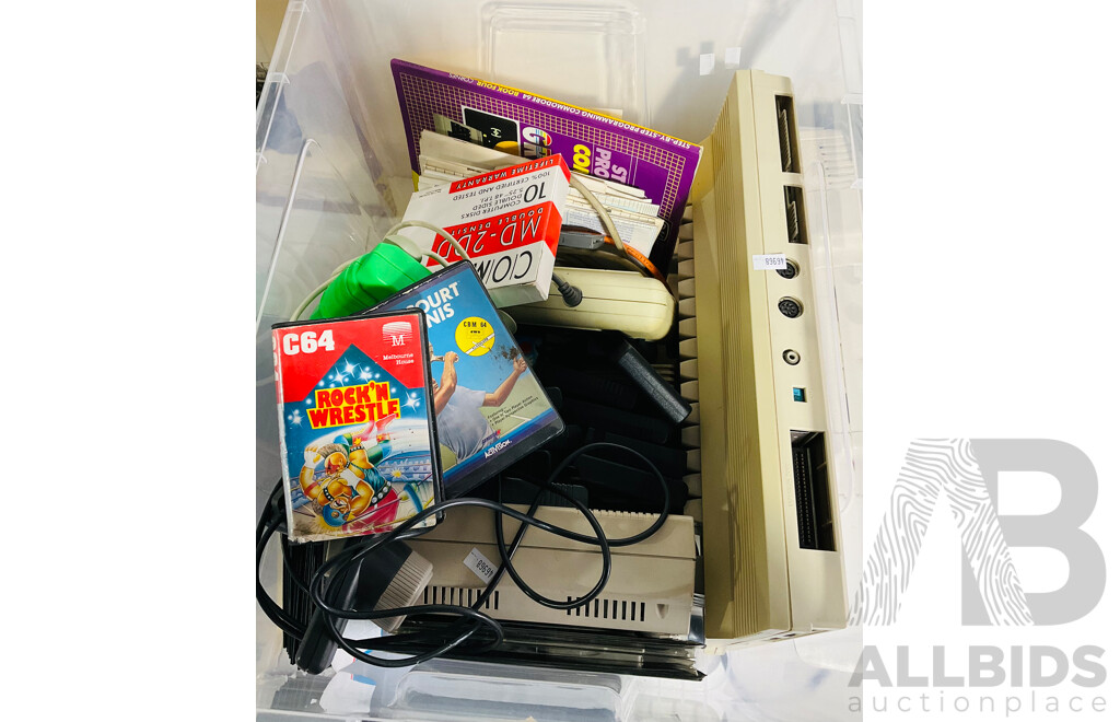 Large Quantity of Vintage Computer Equipment and Accessories Including a Commodore 64, Radio Shack and Tandy Colour Computer 3s, Discs, Controllers, Manuals and More