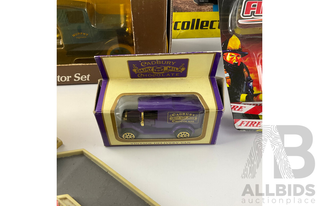 Collection of Boxed Diecast Vehicles Including 2013 La Ferrari, 1931 Hawk Eye Flatbed Truck, Cadbury Delivery Van and Firetruck