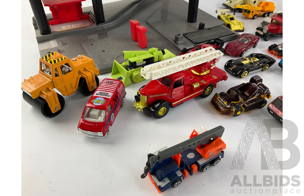 Collection of Diecast Vehicles with Three Level Paking Tower, Includes Matchbox and Hot Wheels