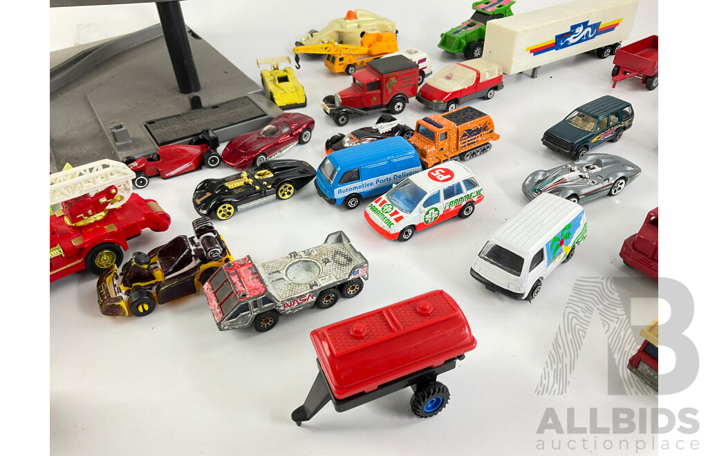 Collection of Diecast Vehicles with Three Level Paking Tower, Includes Matchbox and Hot Wheels