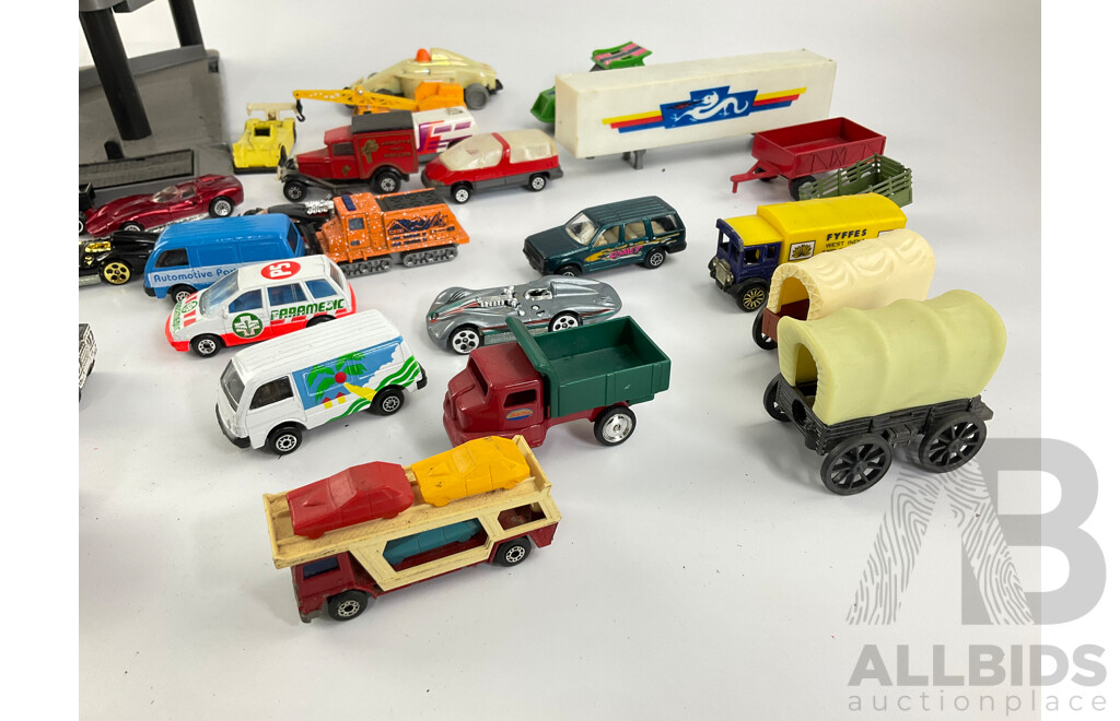 Collection of Diecast Vehicles with Three Level Paking Tower, Includes Matchbox and Hot Wheels