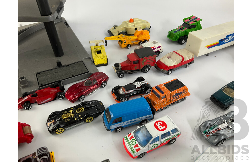 Collection of Diecast Vehicles with Three Level Paking Tower, Includes Matchbox and Hot Wheels