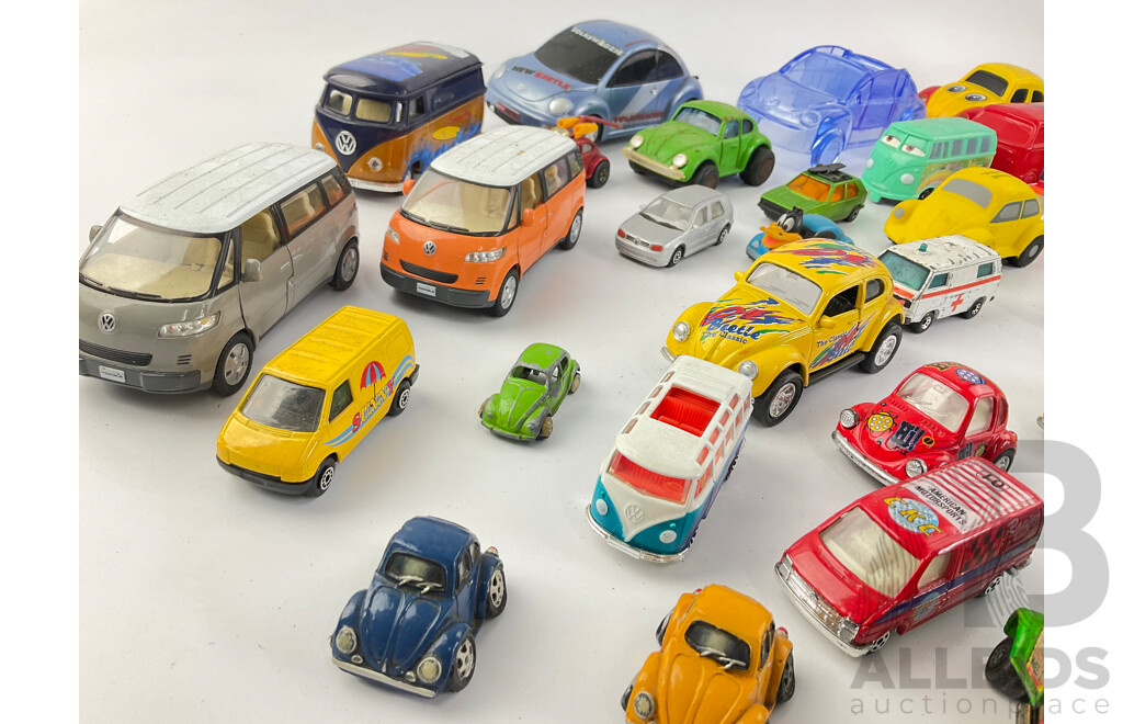 Collection of Diecast and Plastic Volkswagens, Includes Badges Perfume Bottles and Money Bank