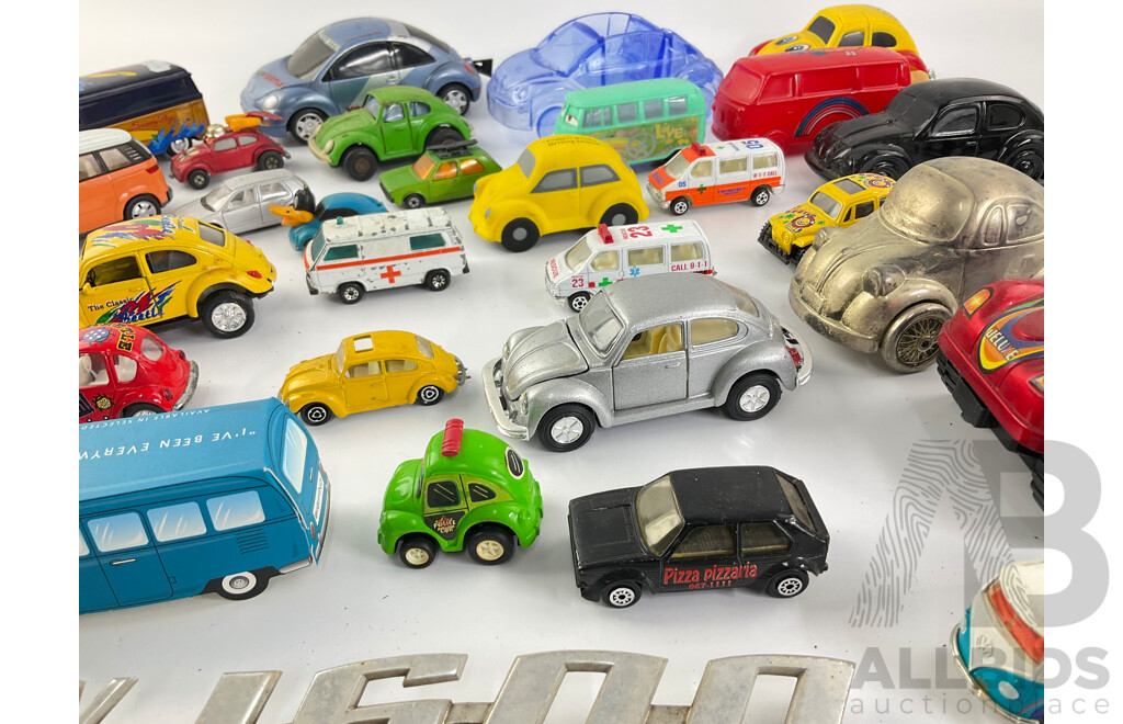 Collection of Diecast and Plastic Volkswagens, Includes Badges Perfume Bottles and Money Bank