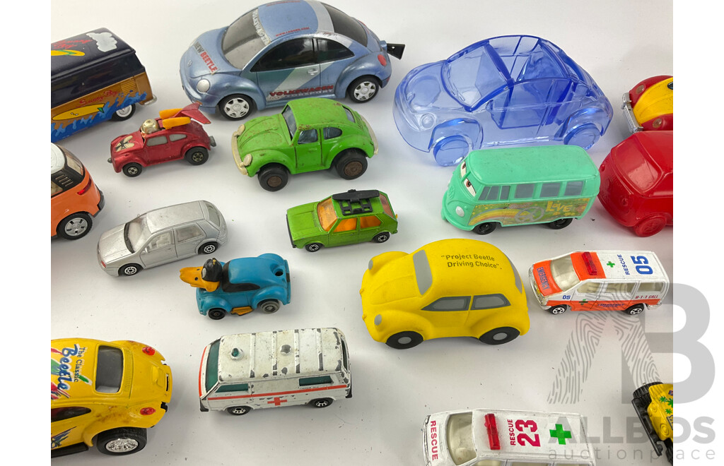 Collection of Diecast and Plastic Volkswagens, Includes Badges Perfume Bottles and Money Bank