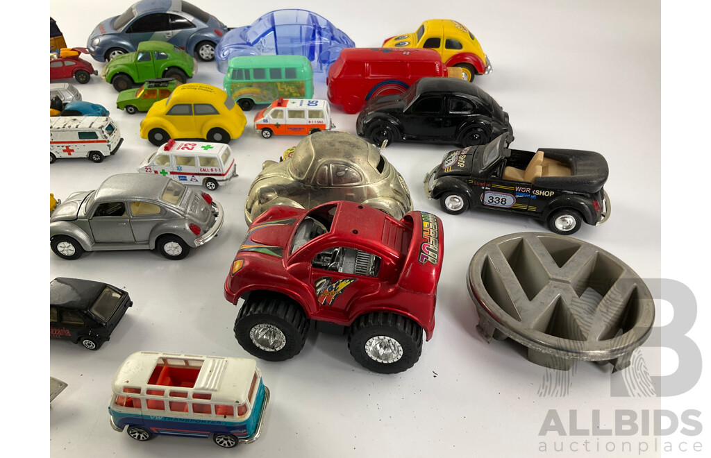 Collection of Diecast and Plastic Volkswagens, Includes Badges Perfume Bottles and Money Bank