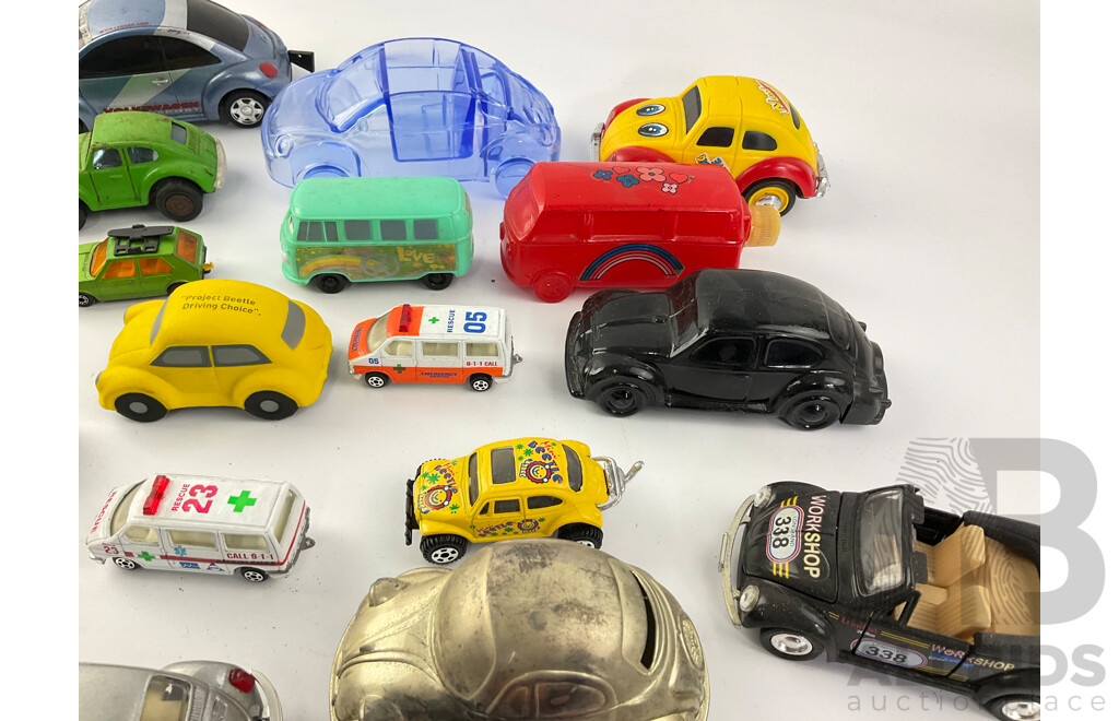 Collection of Diecast and Plastic Volkswagens, Includes Badges Perfume Bottles and Money Bank