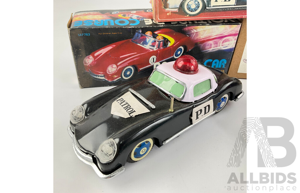 Pressed Steel Clockwork and Friction Drive Cars Including Convertible, Police and Classic Cars with Original Boxes