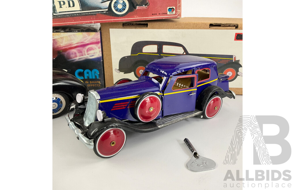 Pressed Steel Clockwork and Friction Drive Cars Including Convertible, Police and Classic Cars with Original Boxes