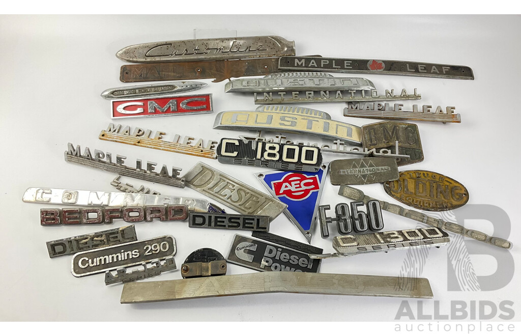 Collection of Vintage Truck Badges Including International, Chevrolet, Ford, GMC, Fordson, Austin, Cummins