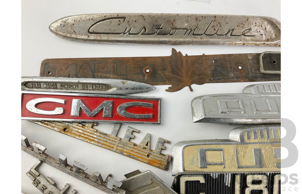 Collection of Vintage Truck Badges Including International, Chevrolet, Ford, GMC, Fordson, Austin, Cummins