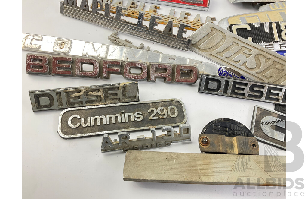 Collection of Vintage Truck Badges Including International, Chevrolet, Ford, GMC, Fordson, Austin, Cummins