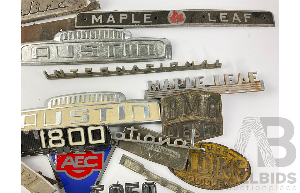 Collection of Vintage Truck Badges Including International, Chevrolet, Ford, GMC, Fordson, Austin, Cummins