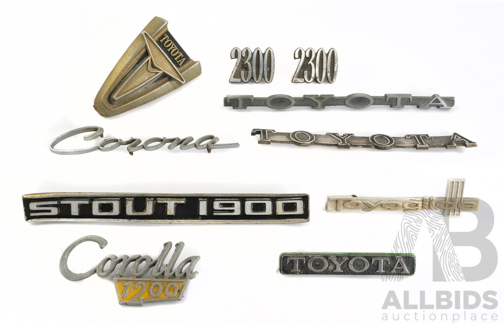 Collection of Vintage Toyota Badges Including Stout, Corolla, Corona, 2300, Toyoglide