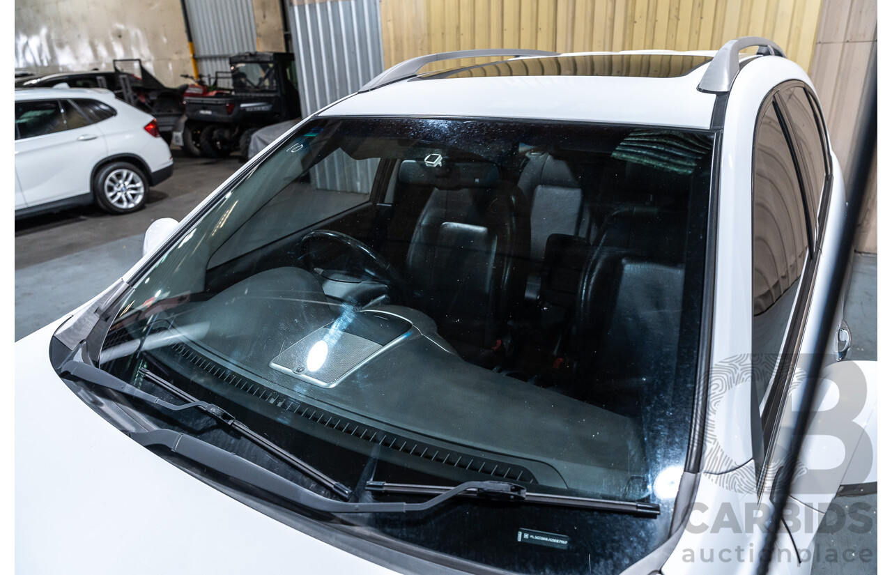 12/2012 Holden Captiva 7 LX (4x4) Series 2 CG MY12 4d Wagon White Turbo Diesel 2.2L - 7 Seater