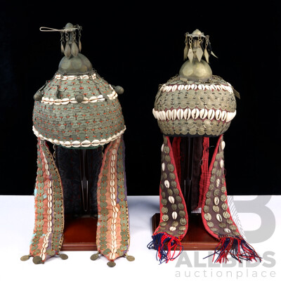 Two Early 20th C Turkoman Wedding Headdress. Each with alloy finial over a quilted cap, decorated with bells, silvered panels and cowrie shells. 