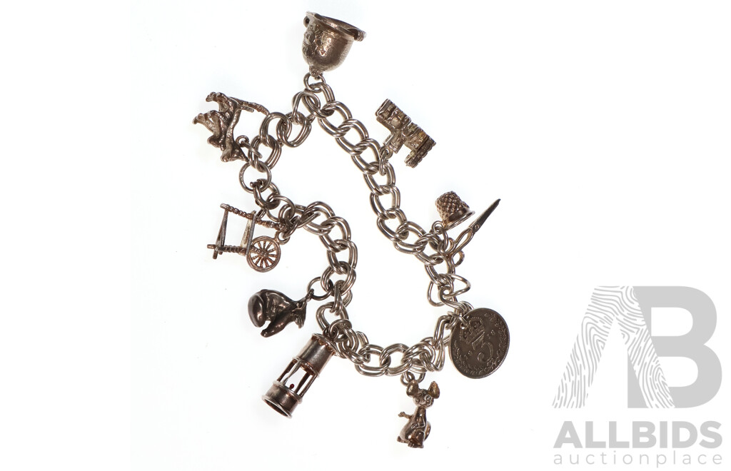 Sterling Silver Vintage Charm Bracelet with (9) Vintage Sterling Silver Charms, 28.31 Grams