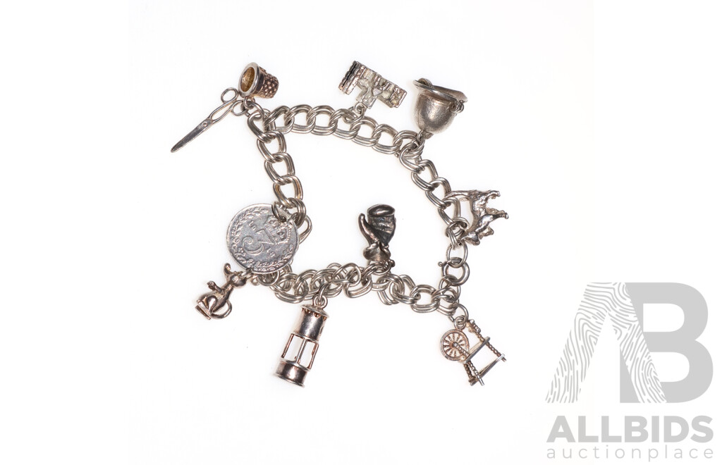 Sterling Silver Vintage Charm Bracelet with (9) Vintage Sterling Silver Charms, 28.31 Grams