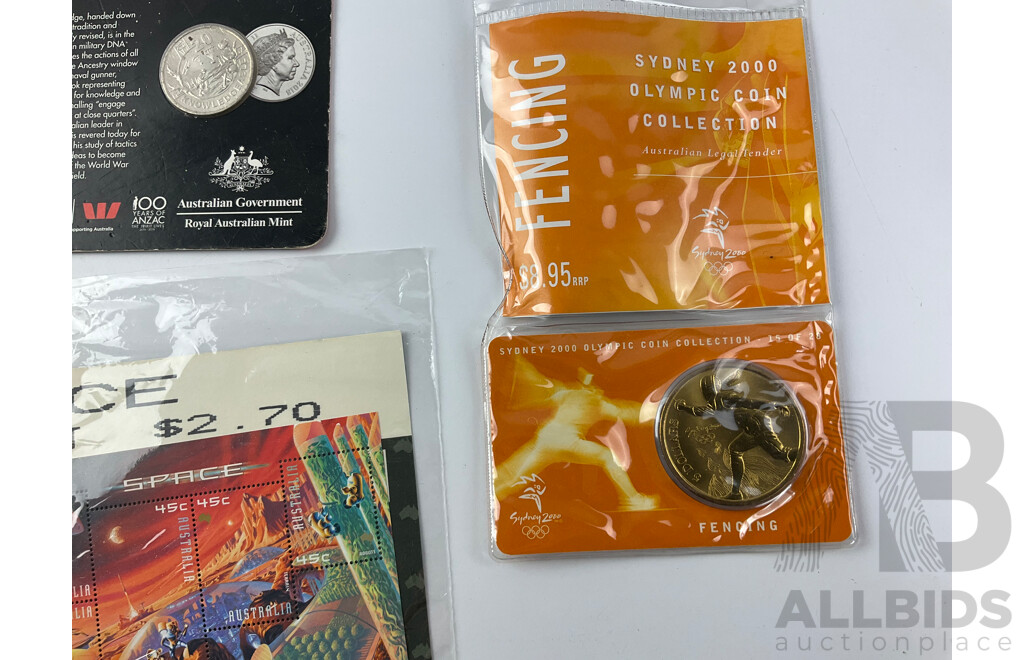 Collection of Coins Stamps and Token Including Australian 2018 Commemorative Twenty Cent Coin, Knowledgeable, Commemorative Five Dollar, Fencing, Manly Ferry Turnstile Token, Space Stamp Mini Sheet and More