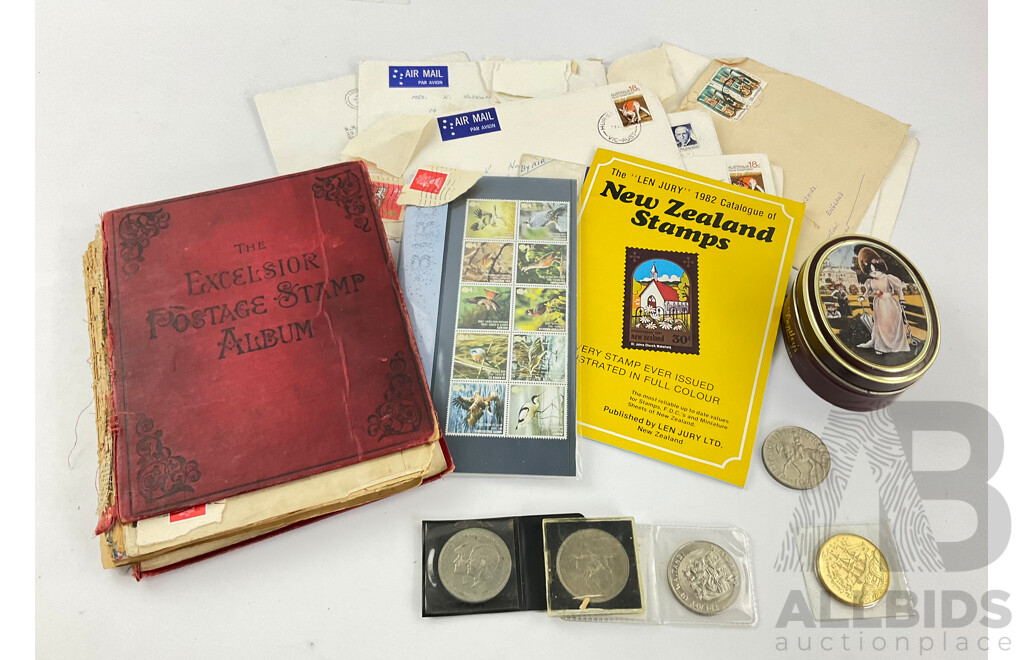 Collection of Commemorative United Kingdom Crowns, Stamp Pack, New Zealand Coin with Vintage Excelsior Stamp Album and More