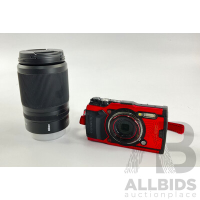 Olympus Tough F2.0 Digital Camera and Nikkon/Nikkor DX 50-25/4.5-6.3 Camera Lens