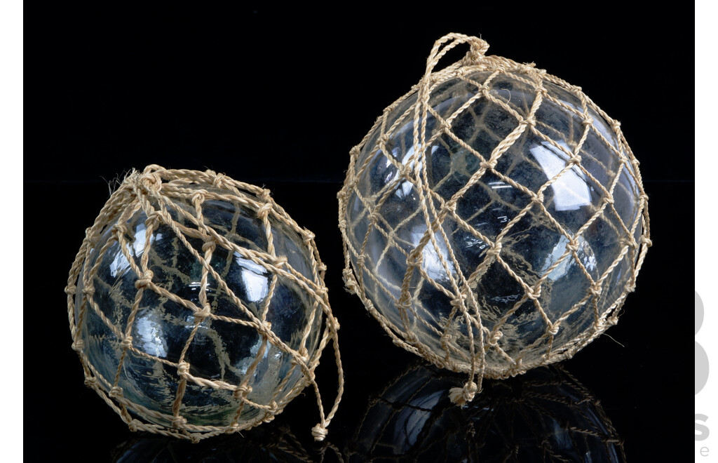 Two Decorative Glass Floats in Mesh