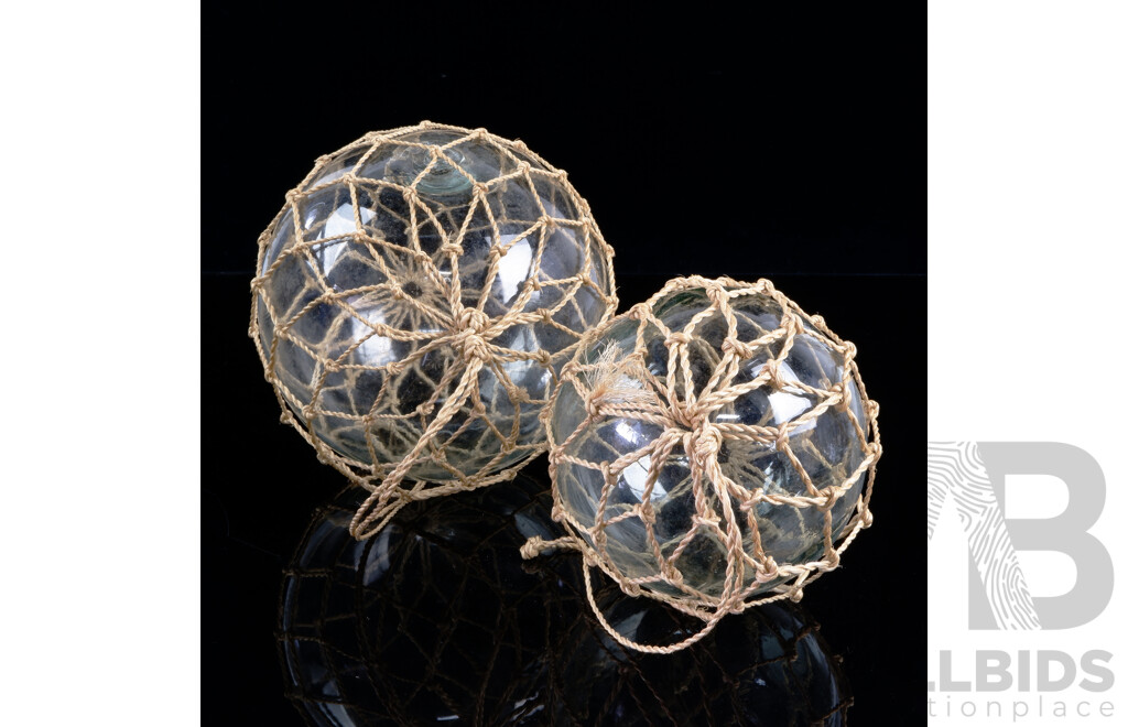 Two Decorative Glass Floats in Mesh