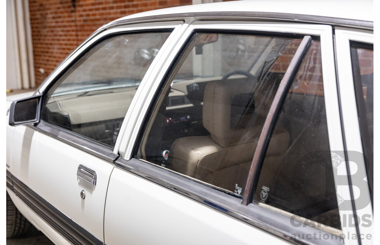 6/1987 Holden Commodore VL Turbo SL BT1 4d Sedan White Turbo 3.0L - Ex-Police - Modified