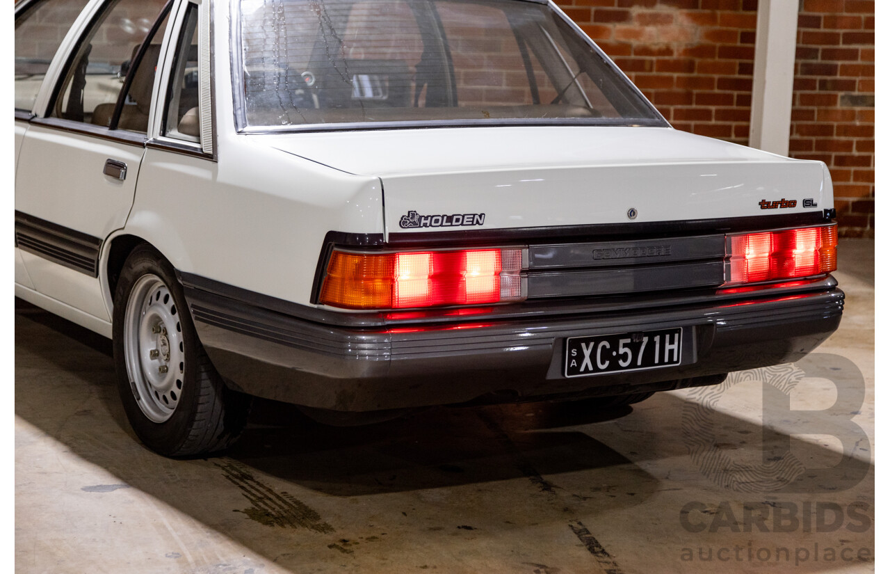 6/1987 Holden Commodore VL Turbo SL BT1 4d Sedan White Turbo 3.0L - Ex-Police - Modified