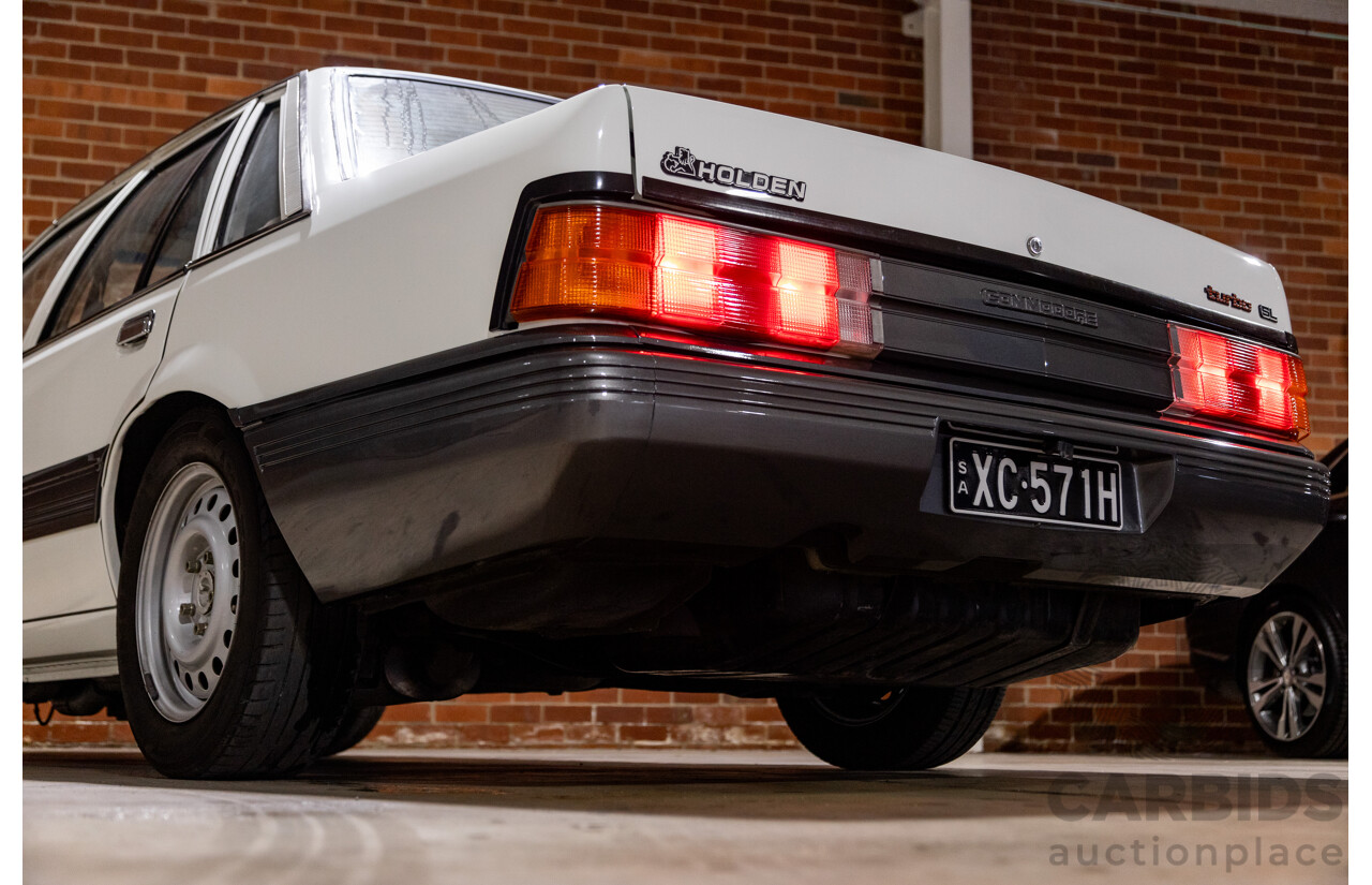 6/1987 Holden Commodore VL Turbo SL BT1 4d Sedan White Turbo 3.0L - Ex-Police - Modified