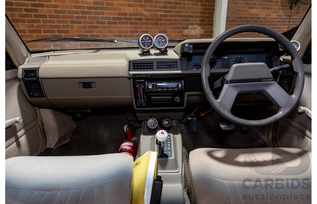 6/1987 Holden Commodore VL Turbo SL BT1 4d Sedan White Turbo 3.0L - Ex-Police - Modified
