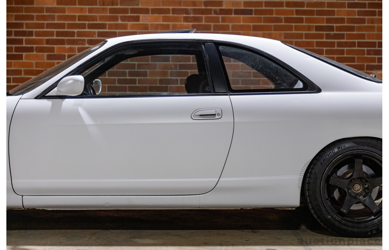 10/1994 Nissan Skyline R33 2d Coupe Ivory Matte White Wrap Turbo 4.0L - Modified with Barra Conversion - 07/2008 Import