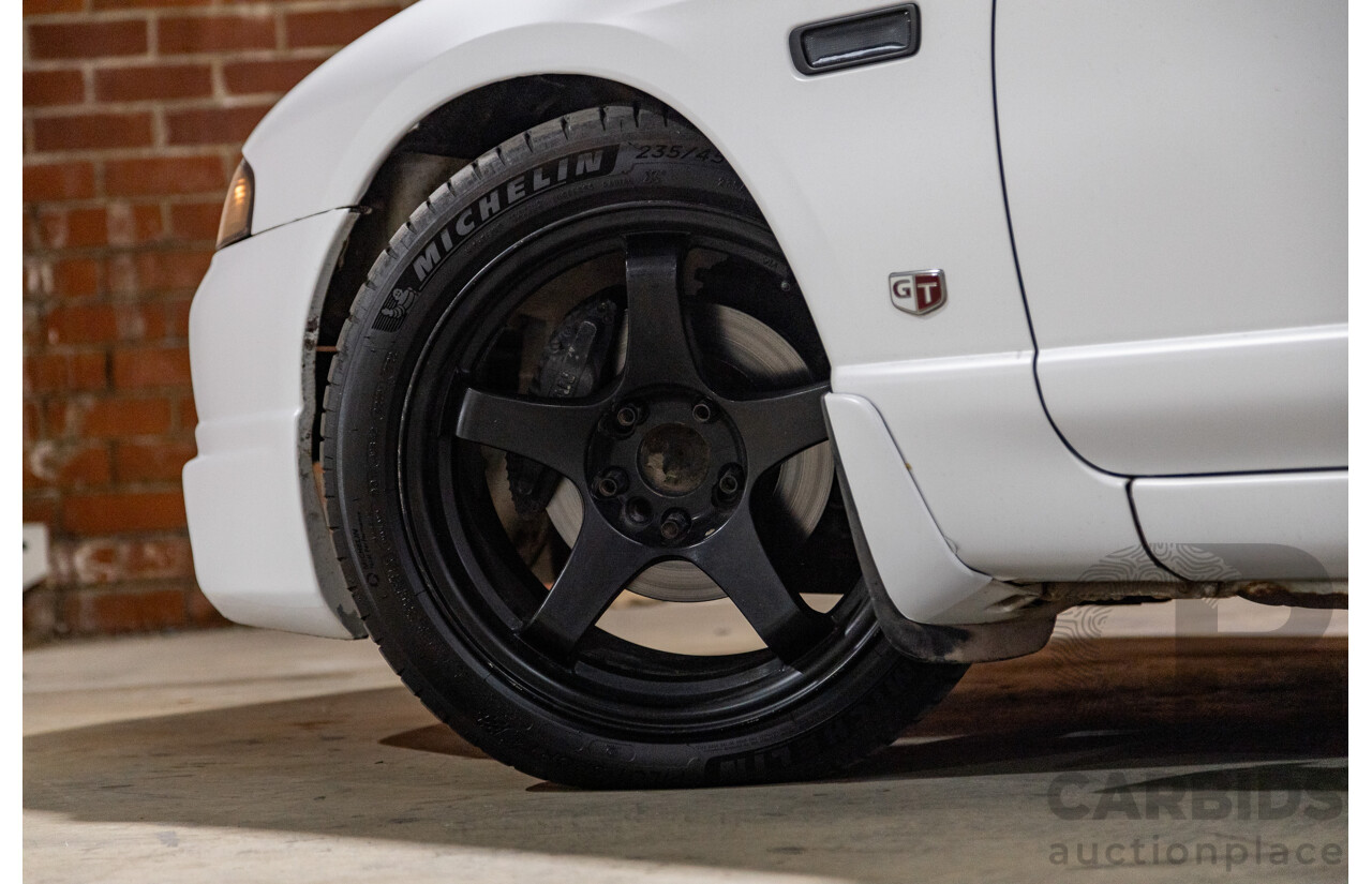 10/1994 Nissan Skyline R33 2d Coupe Ivory Matte White Wrap Turbo 4.0L - Modified with Barra Conversion - 07/2008 Import