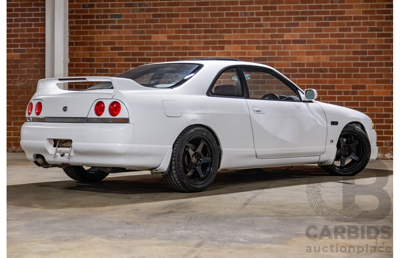 10/1994 Nissan Skyline R33 2d Coupe Ivory Matte White Wrap Turbo 4.0L - Modified with Barra Conversion - 07/2008 Import